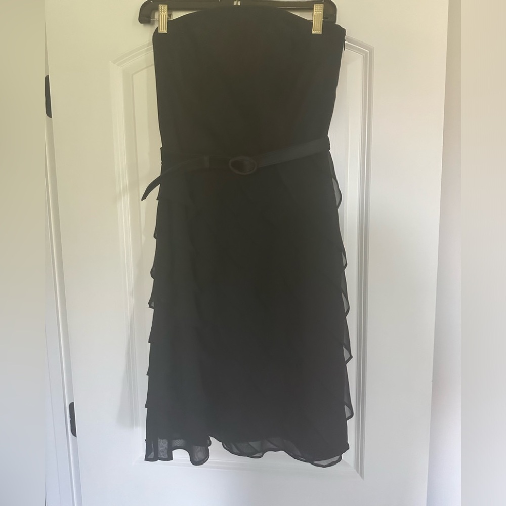 Black strapless dress with ruffled skirt